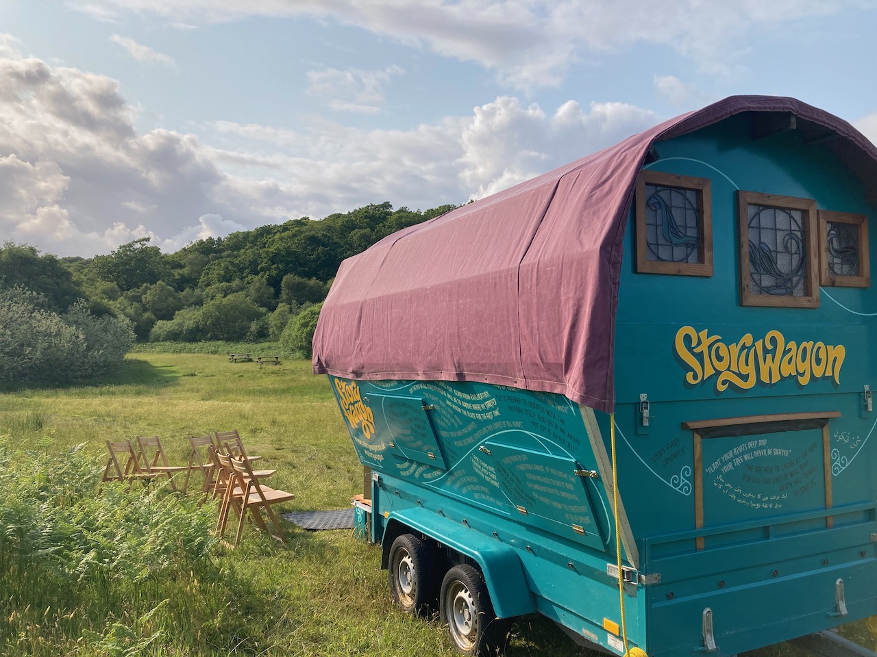 story wagon mobile storytelling performance venue for storytellers on a vehicle trailer sited in community woodland in atlantic rainforest as part of scotland's rainforest storytelling tour